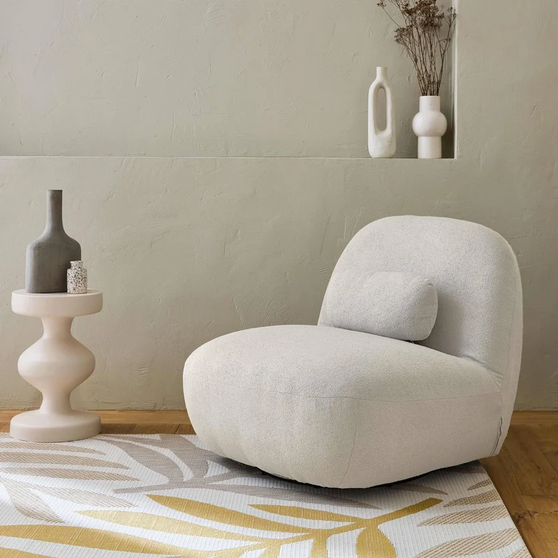 sweeek - Fauteuil pivotant 360° en Bouclette texturée Blanc crème. piètement en métal Noir Mat - Spino