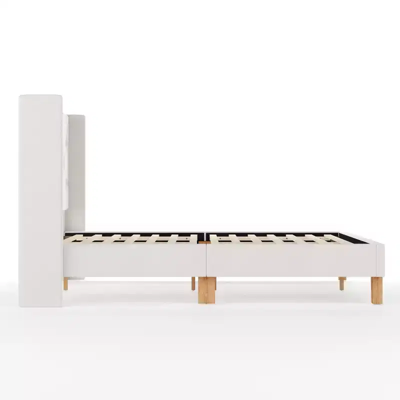 Lit plateforme rembourré avec tête de lit capitonnée à oreilles et longerons latéraux matelassés
